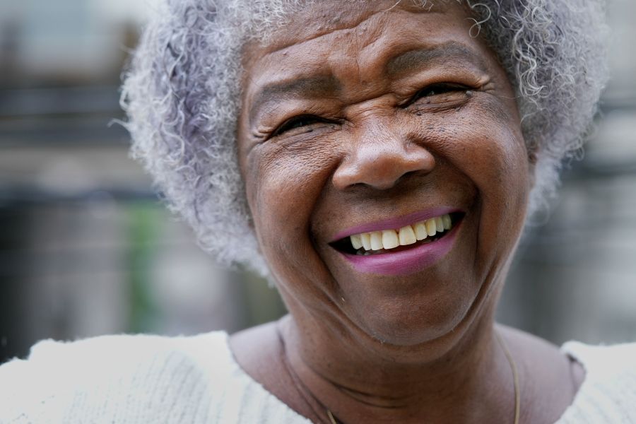 older woman smiling at camera